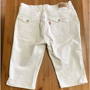 Levi's® 515 Mid–rise 12" inseam vanilla white denim button pocket knee shorts
